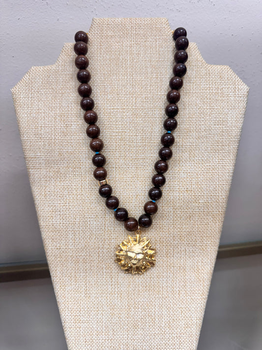 knotty bling brown with large sun medallion necklace